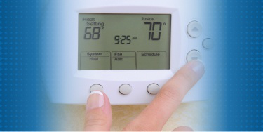 Modern thermostat interface displayed, showing temperature settings and home comfort control.